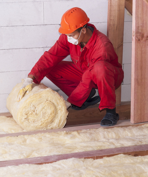 working insulates the attic with mineral wool